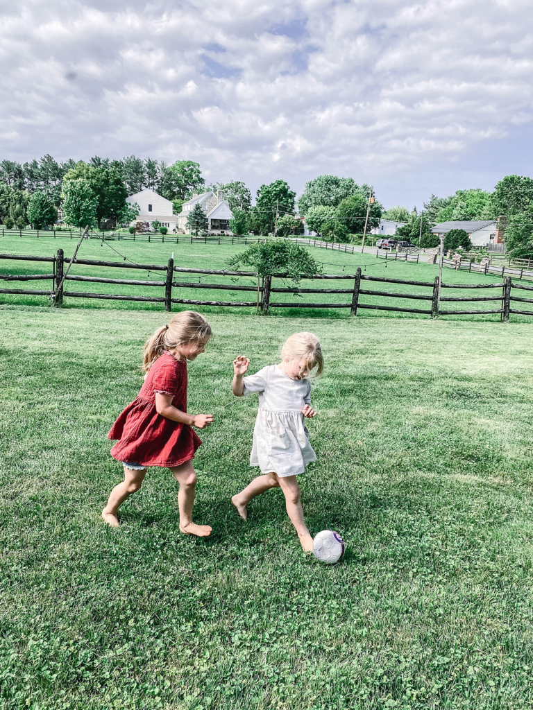 Girls playing soccer together