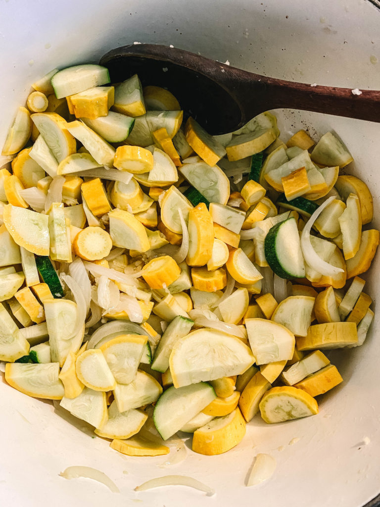 Sauté the squash with onion and garlic
