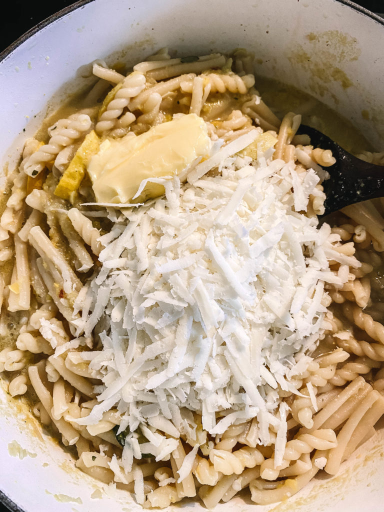 Add butter and cheese to pasta